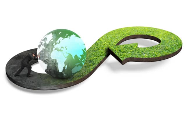 3D infinity symbol with dark industrial half and green grass half, featuring globe and figure representing environmental sustainability concept.