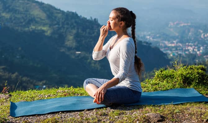 Woman practicing breathing exercises.