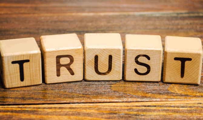 Wooden blocks with the word Trust.