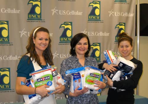 Theresa Tese (center) at a UNCW (University fo North Carolina - Wilmington) basketball 'sock tickets' event