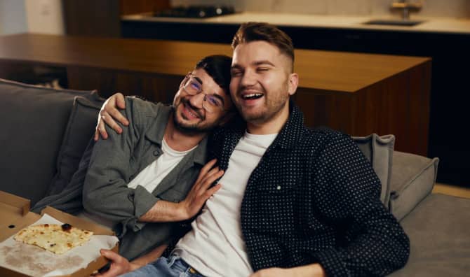 A couple watching a movie together.