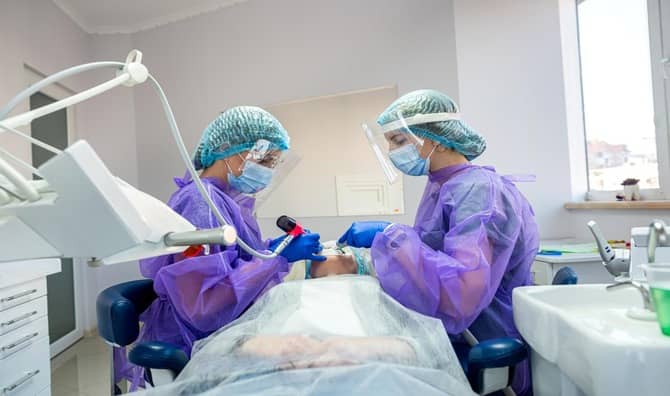 A patient being examined in a dental office.