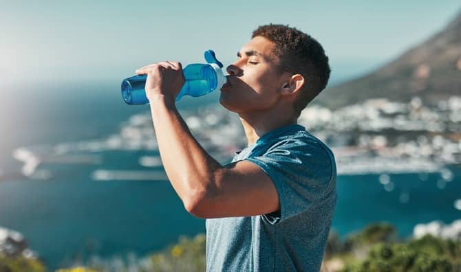 A man drinks water.