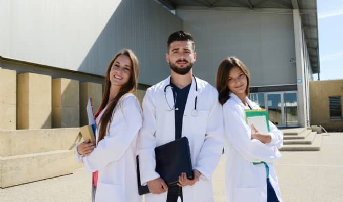 Medical students in white coats.