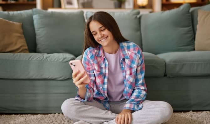 Teenager using AI on her phone.