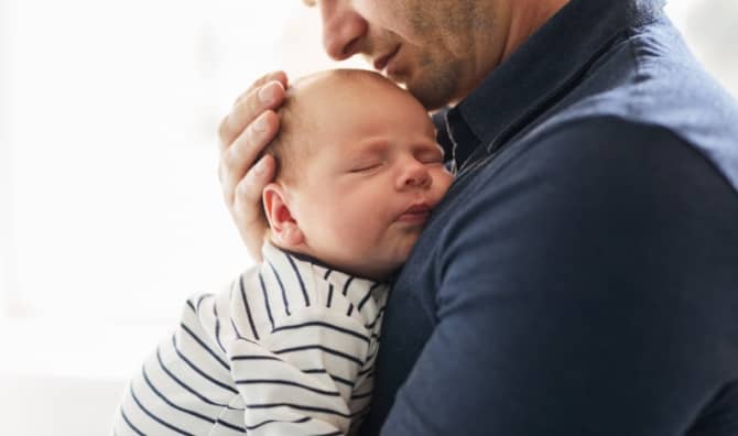 Father holding his newborn.