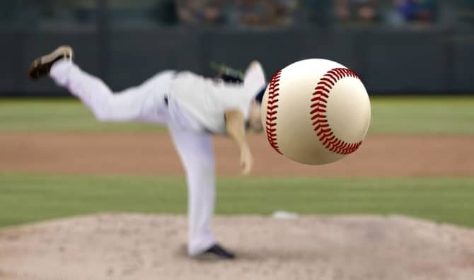 Baseball pitcher throwing to a batter.