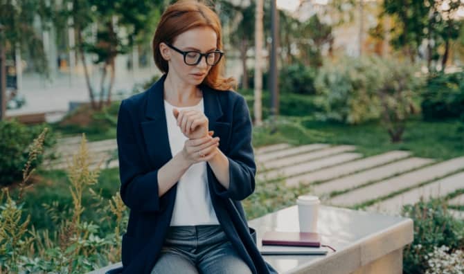 A woman checking her heart rate.