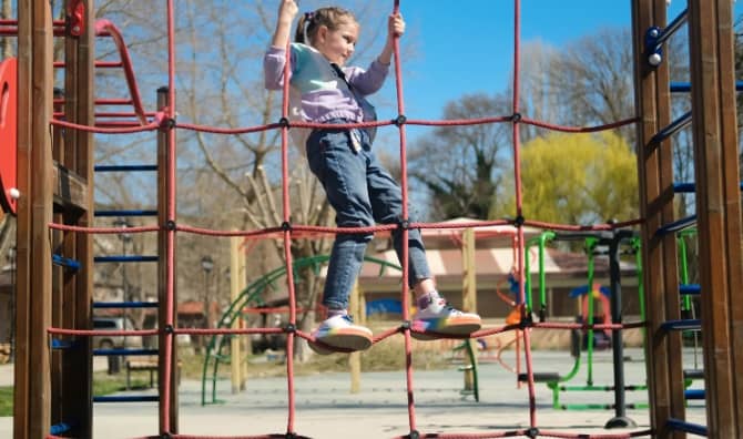 A child playing in an urban park.