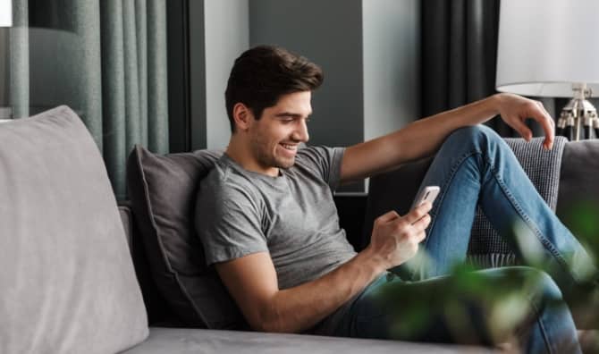 A man looks at his phone.