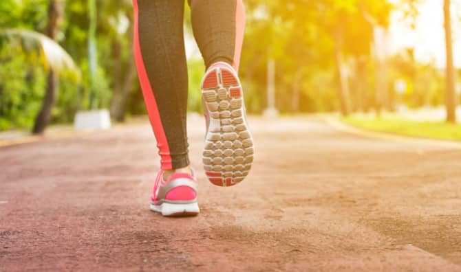 A woman trains and jogs.
