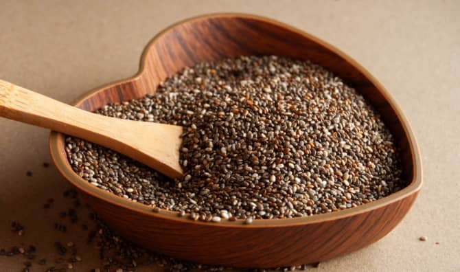 Chia seeds in a heart shaped bowl.