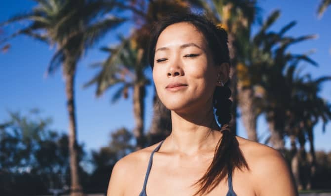 A woman with closed eyes rests.