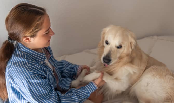 A teenage girl with her pet dog.