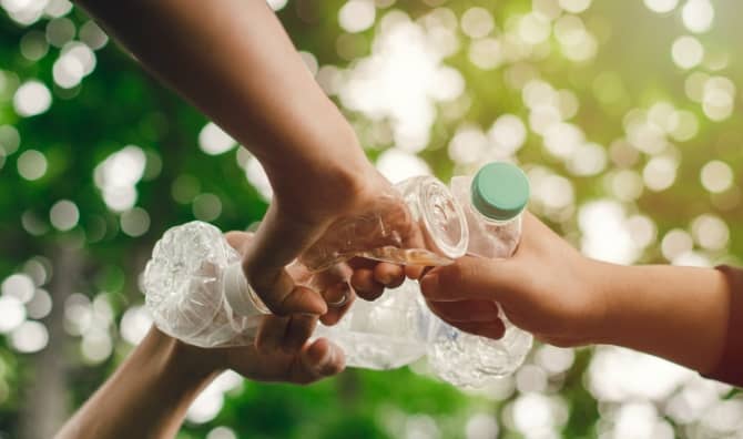 Picking up plastic waste.