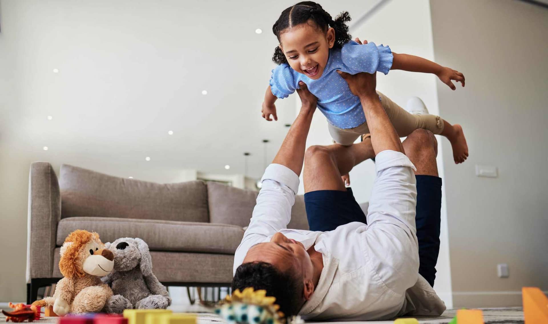 Mexican father and child playing together.