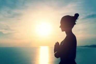 Woman meditating in nature.