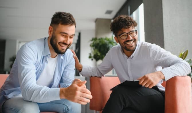 A therapist supports his patient.