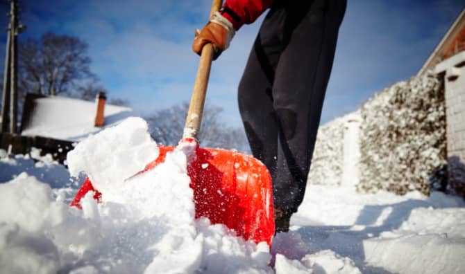 Shoveling snow from sidewalks.