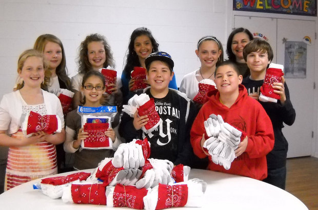photo Children from St Andrews Youth Group, who wrapped socks in handkerchiefs with encouraging messages.