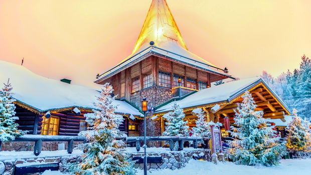 Wooden and stone building with snowy roofs
