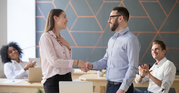 man and woman shaking hands