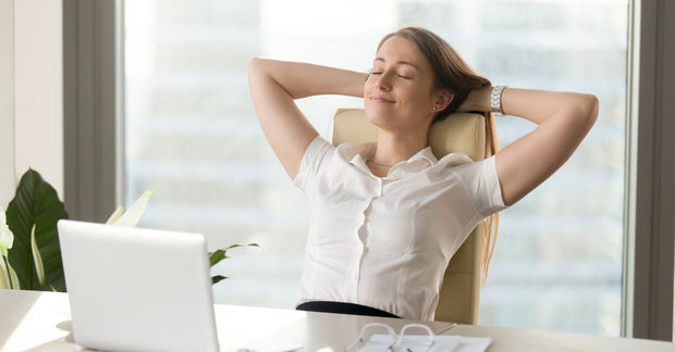 Woman relaxing on a chair in a work office
