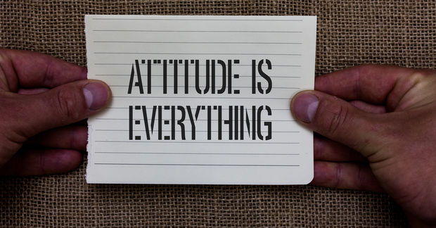 text on paper "ATITTUDE IS EVERYTHING"