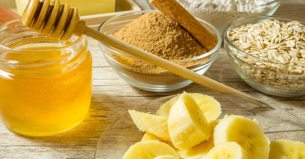 Honey, bananas, oats and spice ingredients displayed.