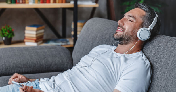 Man listening with headphones.