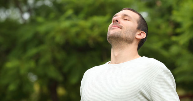 Man doing breathing exercise.