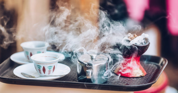 Traditional cup of Ethiopian coffee served with aromatic essence held to ward off bad spirits.