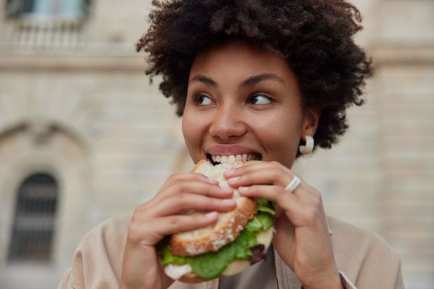 woman eating a sandwich